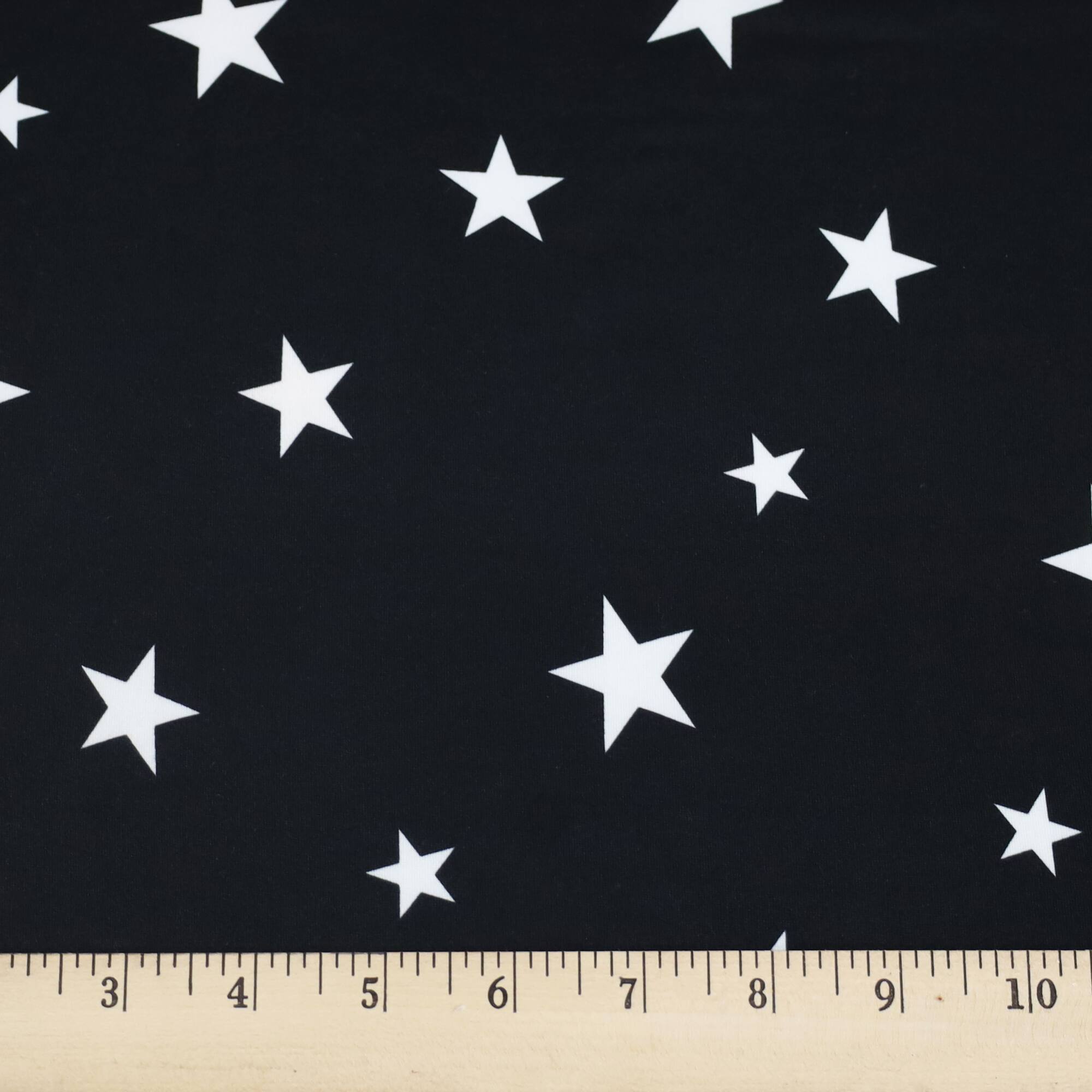 Fabric Merchants Stars on Black Double Brushed Stretch Fabric